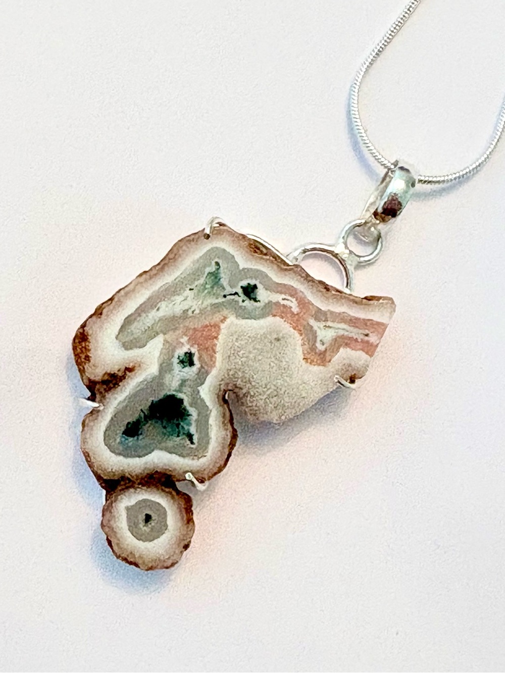 2 inch, natural edges, Tree Agate in Solar Slice pendant on a silver chain.